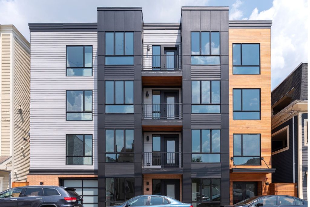 Exterior of South Boston residential units with 4 floors and a mixture of textures including wood and siding