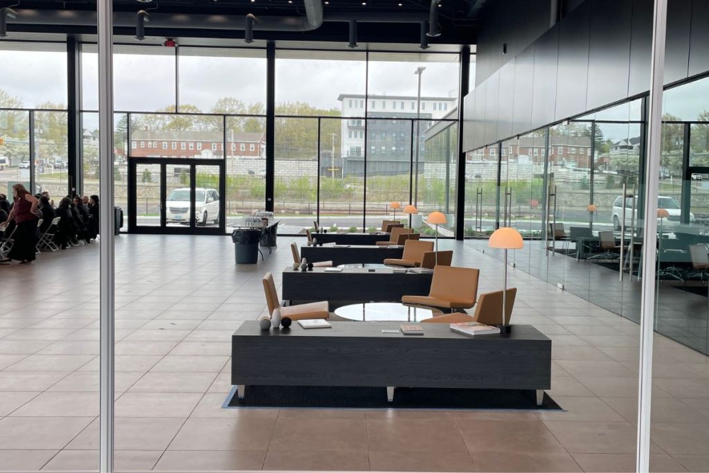 Braintree luxury automotive interior with desks and chairs and a modern sleek design in Braintree, MA