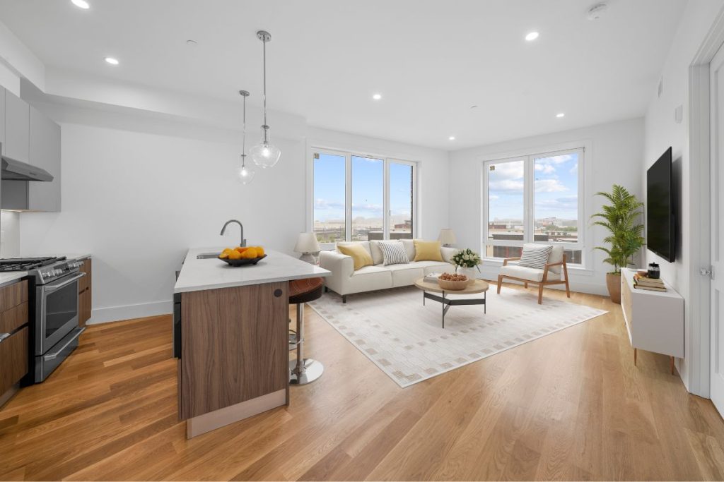Open plan kitchen and living room with modern furniture in a South Boston apartment