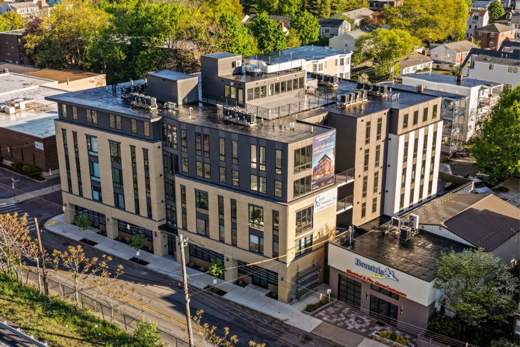 Exterior of Brighton apartment building with retail on ground floor