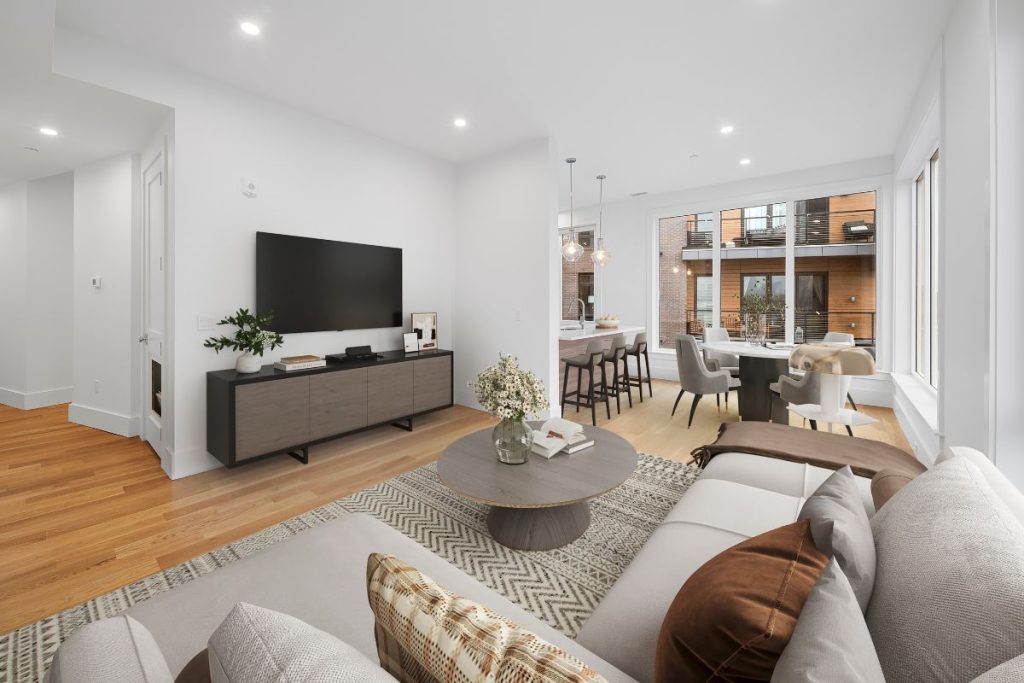 Open plan dining, living and kitchen in South Boston Residential Development fully staged with modern furniture