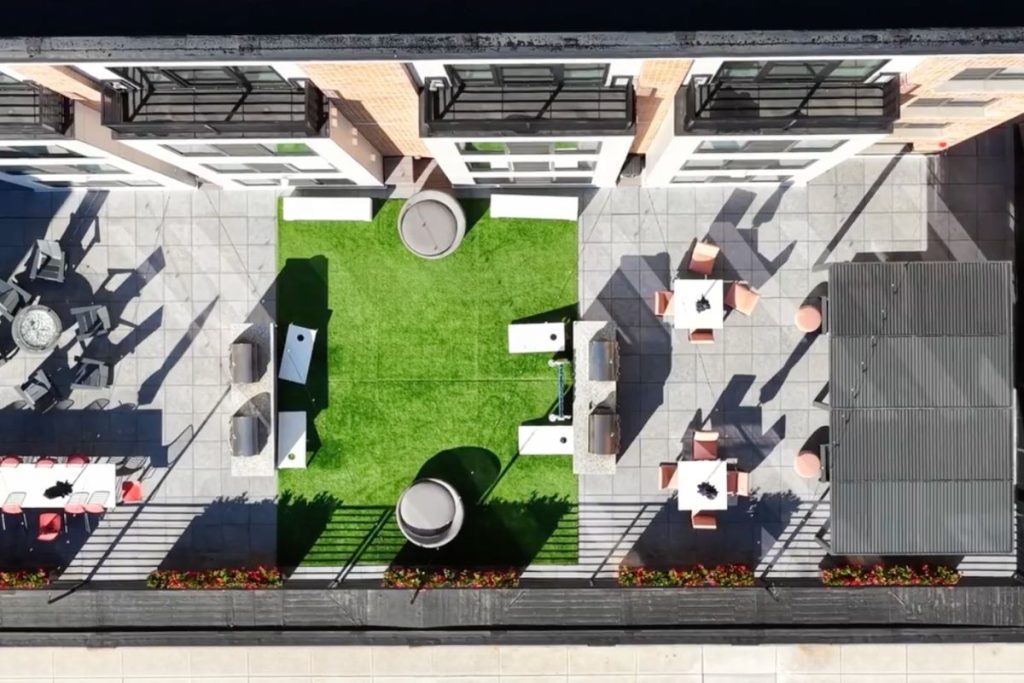 Arial view of a green exterior patio space in Quincy luxury apartments designed by Choo Architects